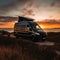 Sleek and Modern Camper Van Parked on a Quiet Country Road with Sunset