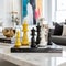 Sleek Modern Chess Set on White Marble Table - Vibrant Colors, Elegant Surroundings