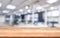 Sleek Office Elegance: Wooden Board Resting on Blurred Empty Room Background