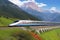 A sleek, silver bullet train speeding through a vibrant, technicolor landscape.