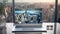 Sleek Silver Laptop with Cityscape Wireframe on Raised Keyboard in Modern Office