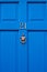 Sleek, simple & beautiful blue wooden front door with the house number 21