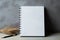 Sleek simplicity White notebook on a cool, gray concrete background