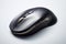 Sleek Tech Companion: Black Computer Mouse on Transparent Background.