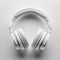 Sleek white headphones arranged neatly on clean white background