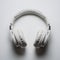 Sleek white headphones with silver accents showcased on plain white background