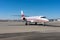 Sleek White Jet Ready for Takeoff on Tarmac Runway