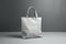 Sleek white mock-up bag showcased against a neutral gray backdrop