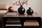 a sleek wooden coffee table with vintage books and a ceramic vase