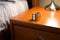sleep tracking smart ring on a wooden nightstand