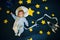 Sleeping baby boy astronaut on a background of the sky