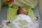 Sleeping babyboy in cot