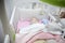 Sleeping four month baby boy lying in cot with mobile