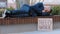 Sleeping homeless fired African American man in city tired with searching job relax on bench. Male sleep outdoors with