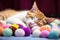 sleeping kitten near pile of soft therapy balls