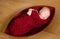Sleeping newborn baby in red cocoon