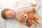 Sleeping, teddy bear and toy with baby in bedroom for carefree, development and innocence. Dreaming, relax and