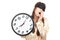 Sleepy Asian girl yawn with eye mask hold a clock