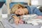 Sleepy bored woman lying on ironing board