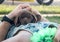 Sleepy brown Labrador male Puppy napping on mans chest mid day