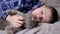 Sleepy Child Hugging, Stroking with a Fluffy Cat, Lying on a Bed in a Bedroom