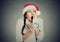 Sleepy christmas woman yawning holding cup of hot beverage