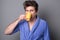 Sleepy man in a bathrobe drinks morning coffee or tea