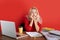 Sleepy puzzled caucasian woman employee in office sit work at desk