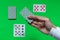 In the sleeve of the dealer producing the distribution of cards on the blackjack table is hidden a winning playing card ACE. The