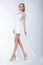 Slender Fashion Model Wearing White Dress