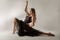Slender girl dancing with a large chain in an incredible ballerina pose