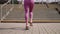 slender legs and buttocks of young sporty woman during training outdoors