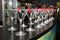Slender rows of empty cocktail glasses on the bar. Decorative red cherry
