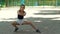 Slender sport girl in shorts doing stretching