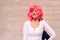 Slender and ugly woman with colorful wig posing ridiculously