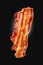 Slice of appetizing fried bacon on a dark background