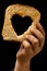 Slice of bread in child\'s dirty hand