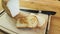 A slice of bread roasted in a pan on an old wooden board