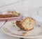 Slice of cake `Ciambellone` with crumbs on ceramic plate painted with floral motifs