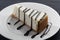 Slice of cheesecake with liquorice sauce