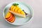 Slice of cheesecake with nectarine topping