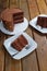 Slice of chocolate cake with filling and semisweet chocolate ganache frosting_vertical