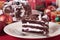 Slice of Christmas black forest gateau cake on plate with decoration