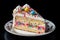 A slice of a delicious frosted birthday cake with a decorative design