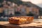 a slice of focaccia, highlighting the dimpled surface, golden crust, and sprinkling of coarse sea salt and rosemary