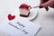 Slice of handmade cherry pie on a plate in white background