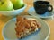 Slice of healthy, fresh-baked apple cake with coffee