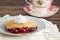 Slice of Homemade Cherry Cobbler on a Blue Antique Saucer