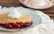 Slice of Homemade Cherry Cobbler on a Blue Antique Saucer