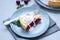 Slice of homemade cherry lattice cake on gray wooden background. Traditional american food